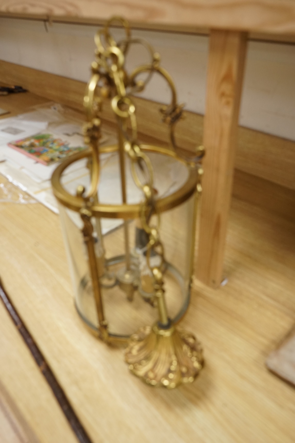 A cylindrical brass hanging hall lantern, 86cm high overall